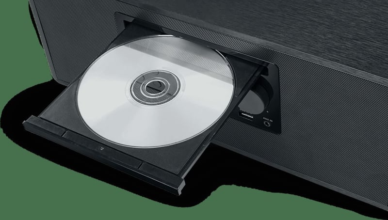 Close-up of Muse M-697 stereo showing CD tray with disc inserted and USB port on front panel.