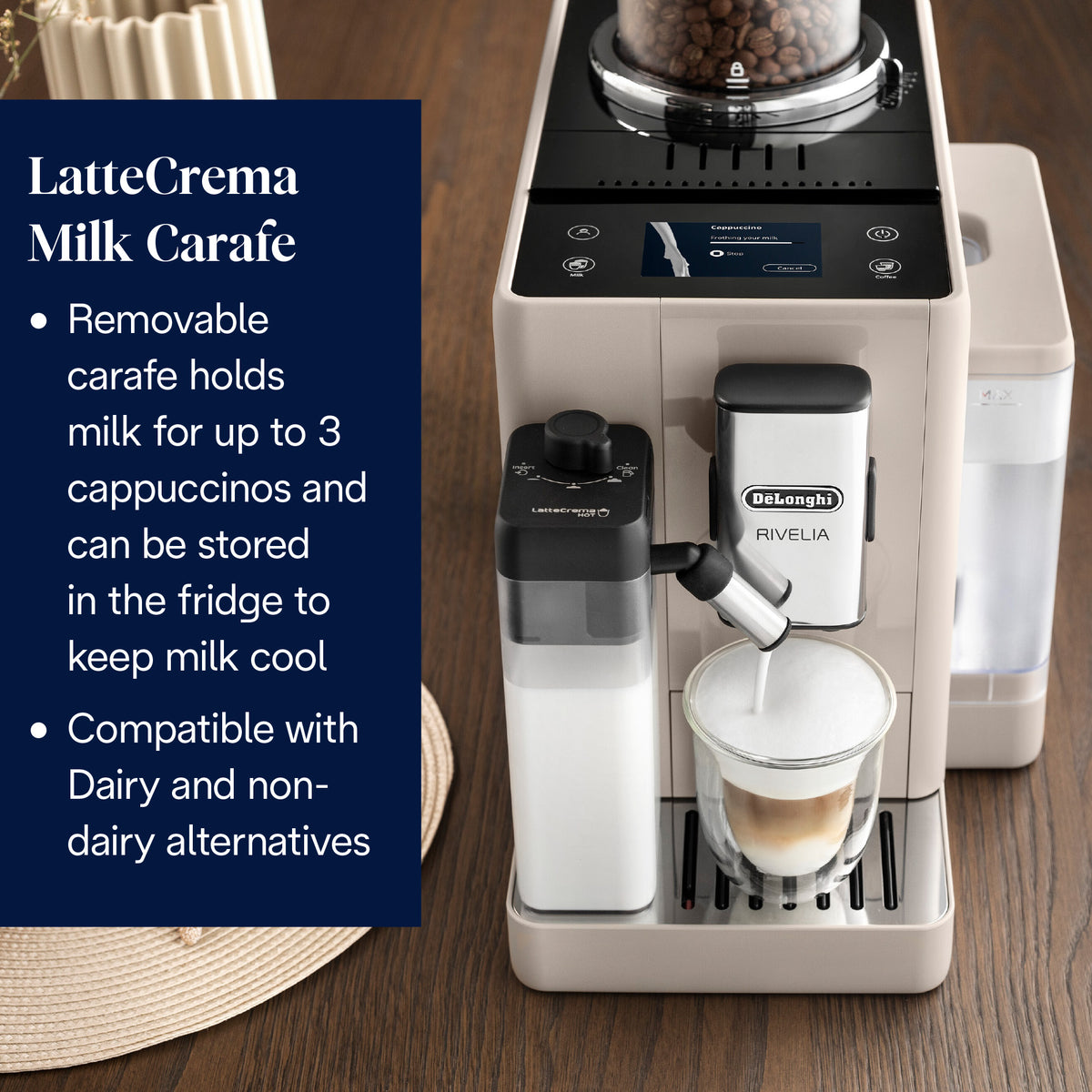 DeLonghi Rivelia cream coffee machine frothing milk into a glass with beans visible in the hopper above.