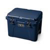 YETI Tundra 35 navy cool box shown closed, angled front view with latches and handle visible