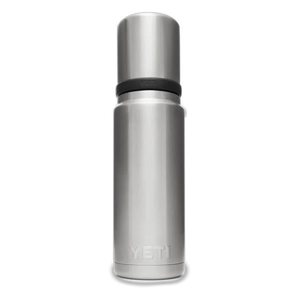 Black Rambler Bottle Cup Cap attached to a stainless steel bottle neck against white background.