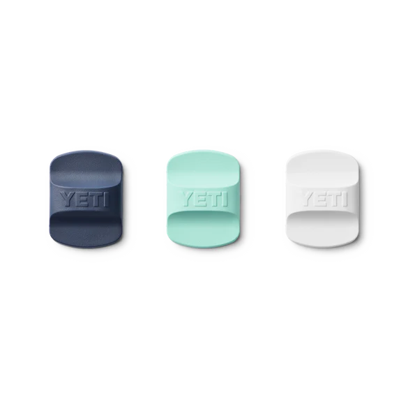 Navy, seafoam, and white YETI Magslider magnetic lid replacements shown side by side on white background.