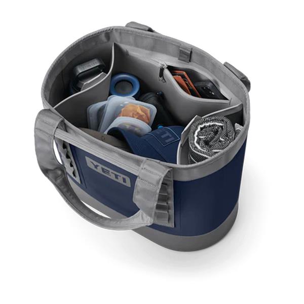 Camino Carryall 35 2.0 navy tote bag with multiple compartments holding various items including a hat and containers
