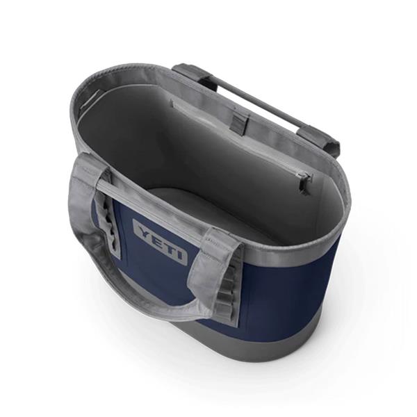 Open navy and gray Camino Carryall 35 2.0 showing interior with zippered pocket and padded handles.