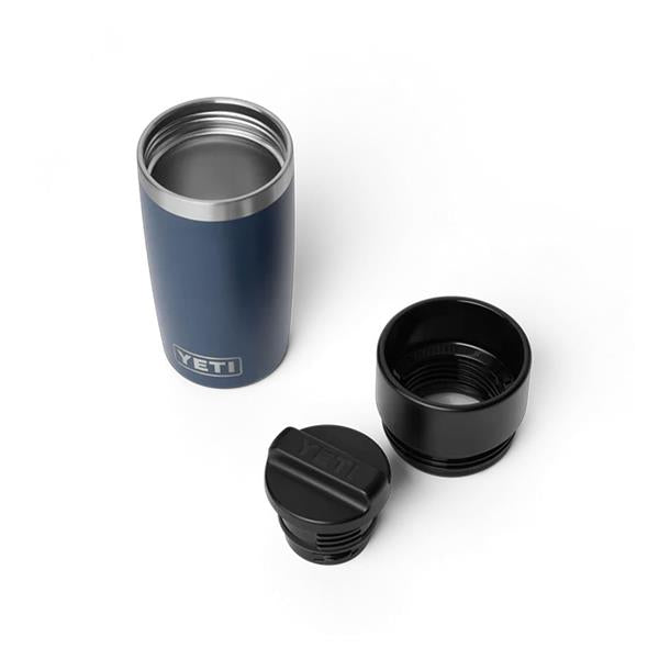 Navy Rambler 12oz travel bottle with open top, black threaded lid, and black cup accessory on white background.