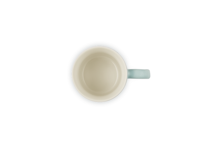Top view of a Le Creuset Stoneware Espresso Mug in Sea Salt color with handle on the right.
