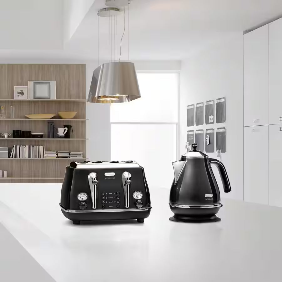 Delonghi Icona Micalite black kettle on a white kitchen counter next to a matching toaster