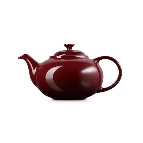 Le Creuset Stoneware Classic Teapot 1.3L in Garnet red, durable and stylish – available at Keans Claremorris.