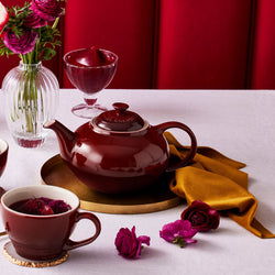 Le Creuset Stoneware Classic Teapot 1.3L in Garnet red, durable and stylish - available at Keans Claremorris.