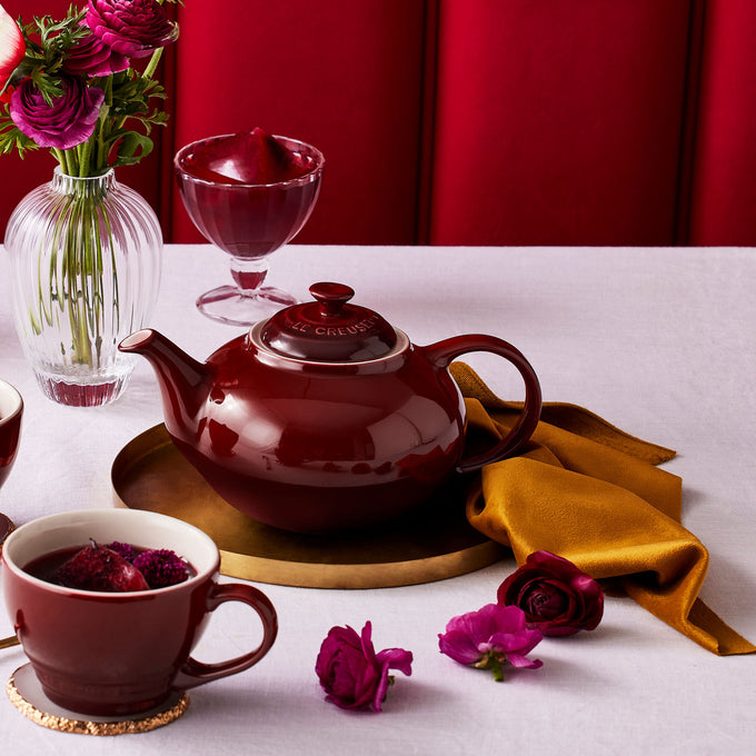 Le Creuset Stoneware Classic Teapot 1.3L in Garnet red, durable and stylish - available at Keans Claremorris.