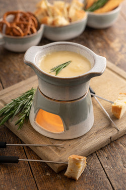 Tivoli Stoneware Fondue Set with ceramic pot and wooden base, perfect for cozy gatherings – available at Keans Claremorris.