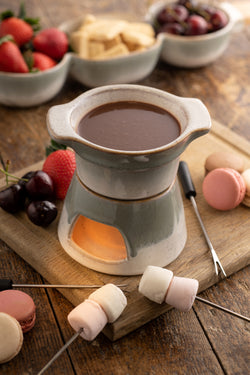 Tivoli Stoneware Fondue Set with ceramic pot and wooden base, perfect for cozy meals – available at Keans Claremorris.