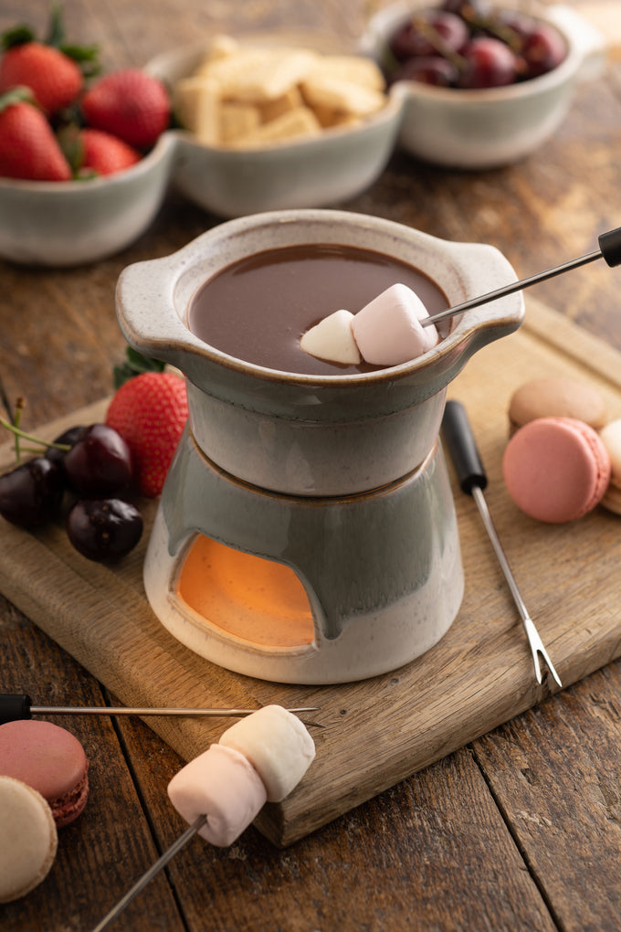 Tivoli Stoneware Fondue Set with ceramic pot and wooden base, perfect for cozy meals – available at Keans Claremorris.