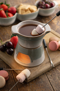 Tivoli Stoneware Fondue Set with ceramic pot and wooden base, perfect for cozy meals – available at Keans Claremorris.