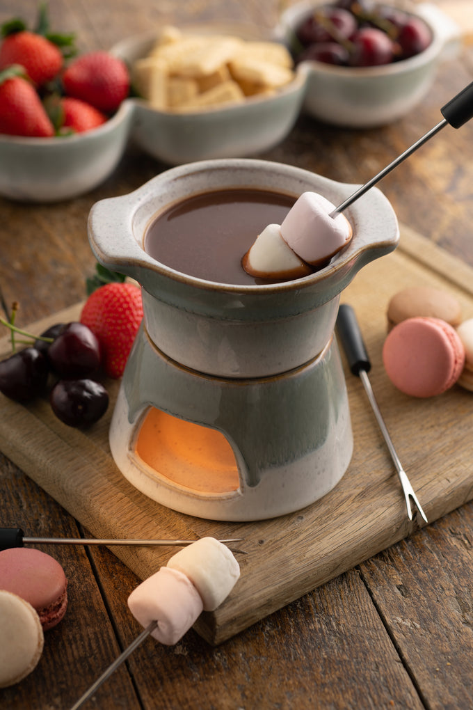 Tivoli Stoneware Fondue Set with ceramic pot and wooden base, perfect for cozy meals – available at Keans Claremorris.