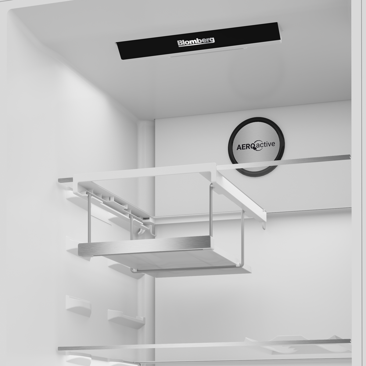 Interior top section of Blomberg freestanding tall larder fridge showing VitaminCare+ and AeroActive features.