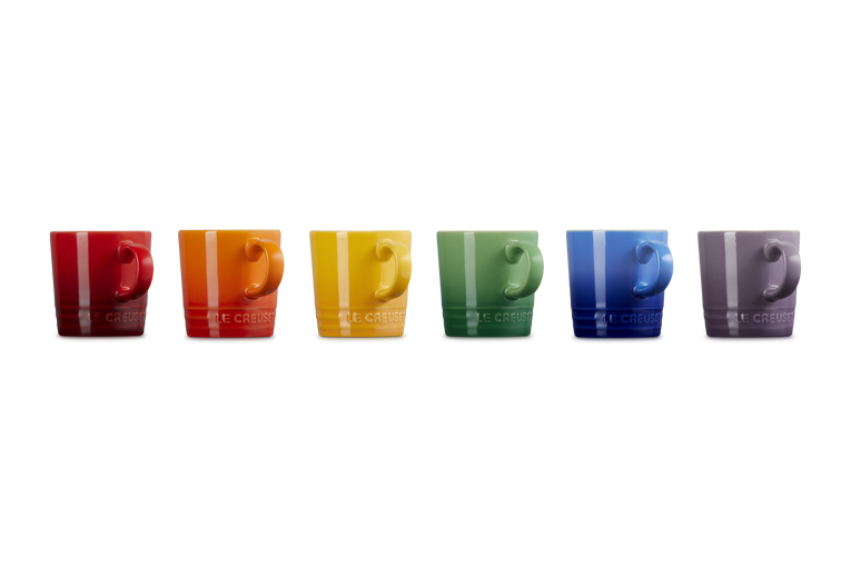 Le Creuset Rainbow set of six espresso mugs in red, orange, yellow, green, blue, and purple, side by side.