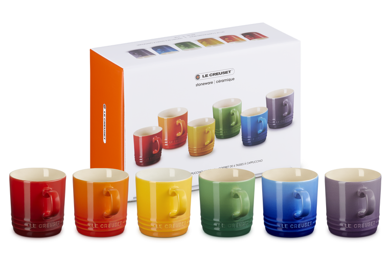 Le Creuset Rainbow Set of 6 cappuccino mugs in red, orange, yellow, green, blue, and purple with packaging box behind.