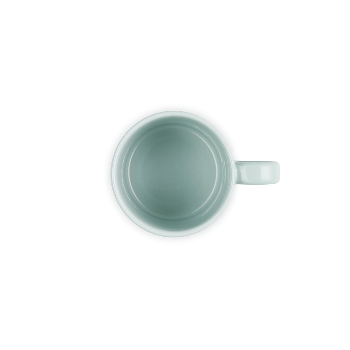 Top view of a pale sea salt blue Le Creuset Capp Mug with handle on the right side against white background