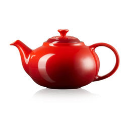 Le Creuset Stoneware Classic Teapot 1.3L in Cerise red, durable and stylish, available at Keans Claremorris.