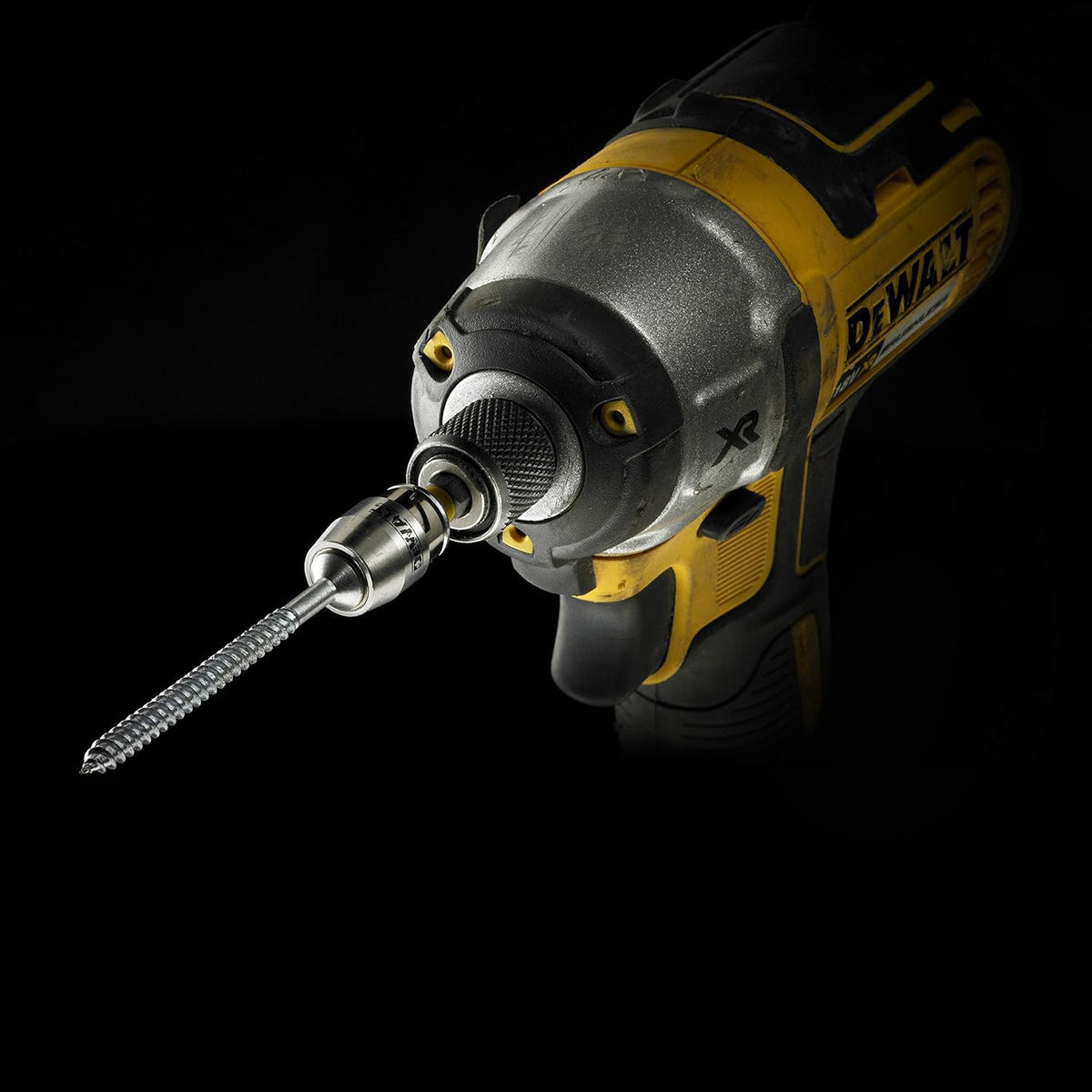DeWalt cordless impact driver with magnetic screwlock sleeve and attached screw bit against black background