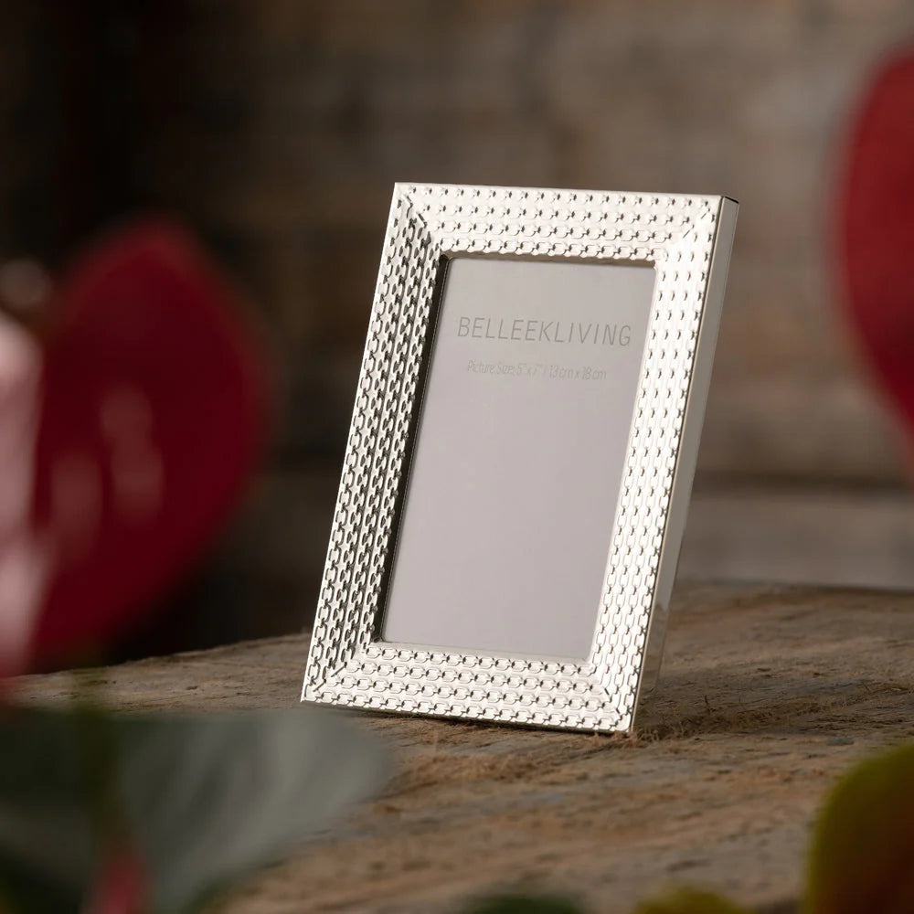 Belleek Living Link 8x10 silver photo frame with a textured chain-link pattern on a wooden surface