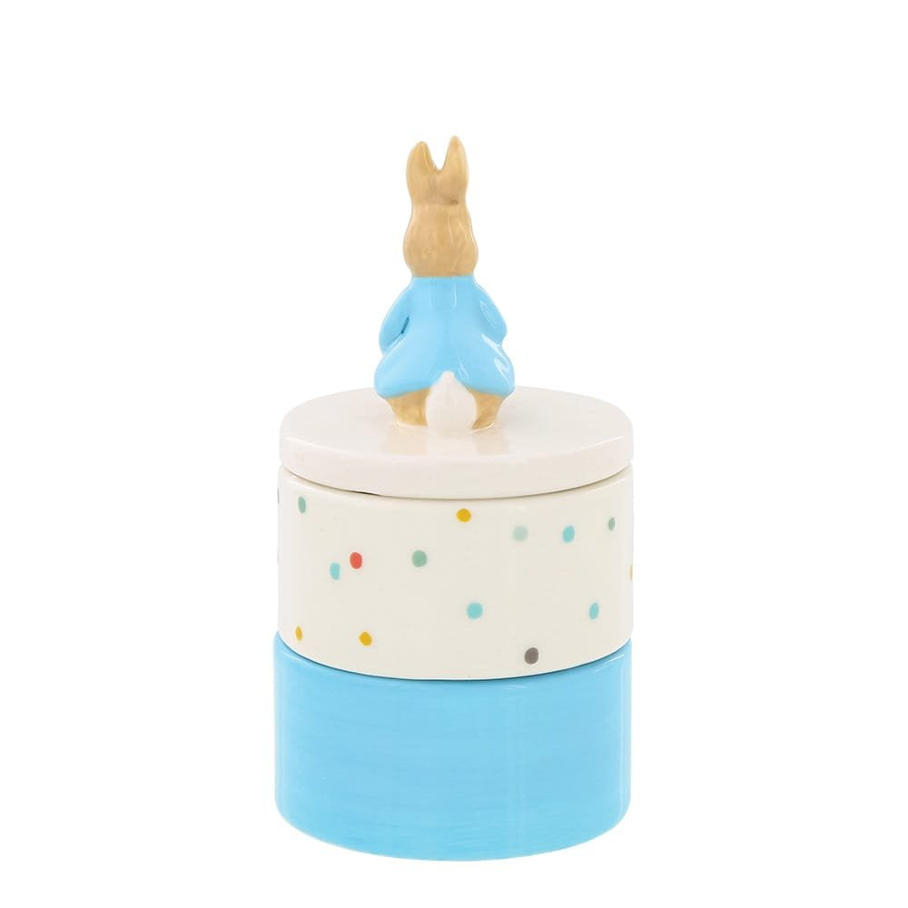Ceramic Peter Rabbit tooth and curl keepsake box with blue base, polka dot middle, and rabbit figure lid handle.