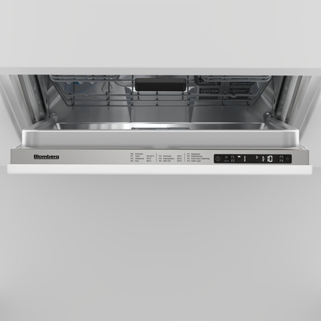 Open Blomberg integrated dishwasher showing control panel and upper rack interior.