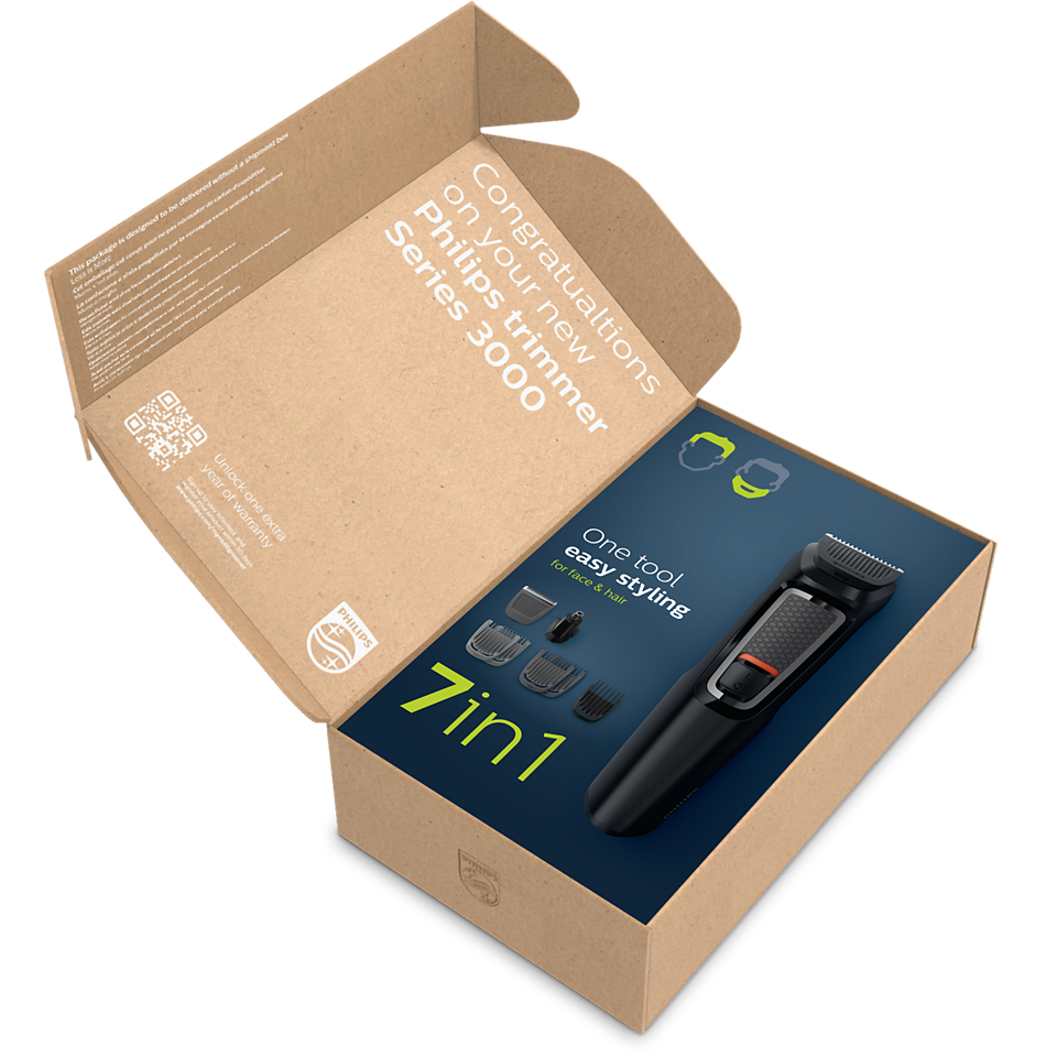 Open cardboard box showing Philips Multigroom Series 3000 7-in-1 grooming kit packaging with trimmer image and attachments.