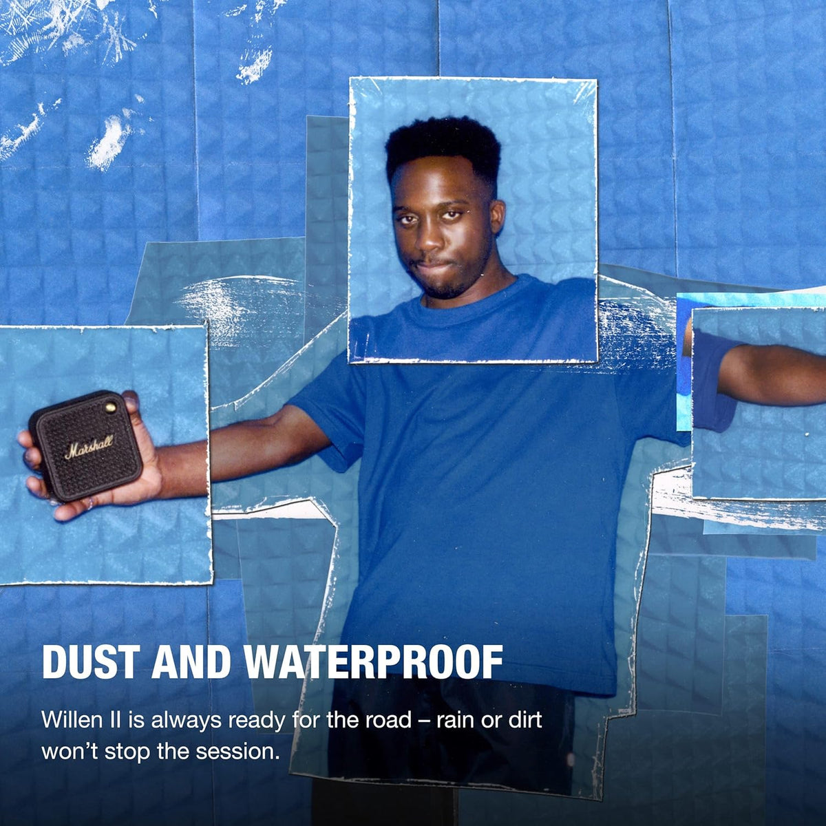 Man in blue shirt holding Marshall Willen II Black & Brass speaker against blue textured background