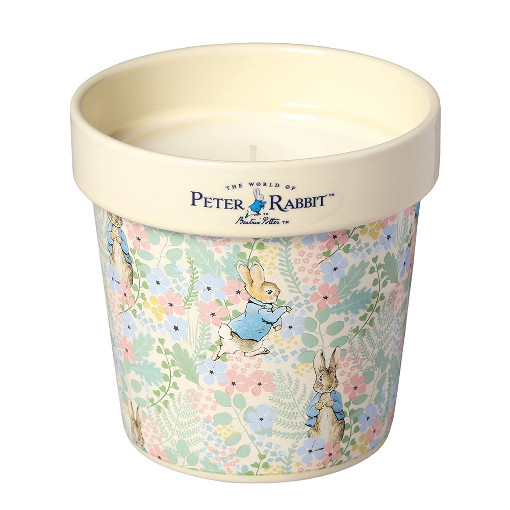 Peter Rabbit candle in a floral ceramic container with pastel flowers and rabbit illustrations