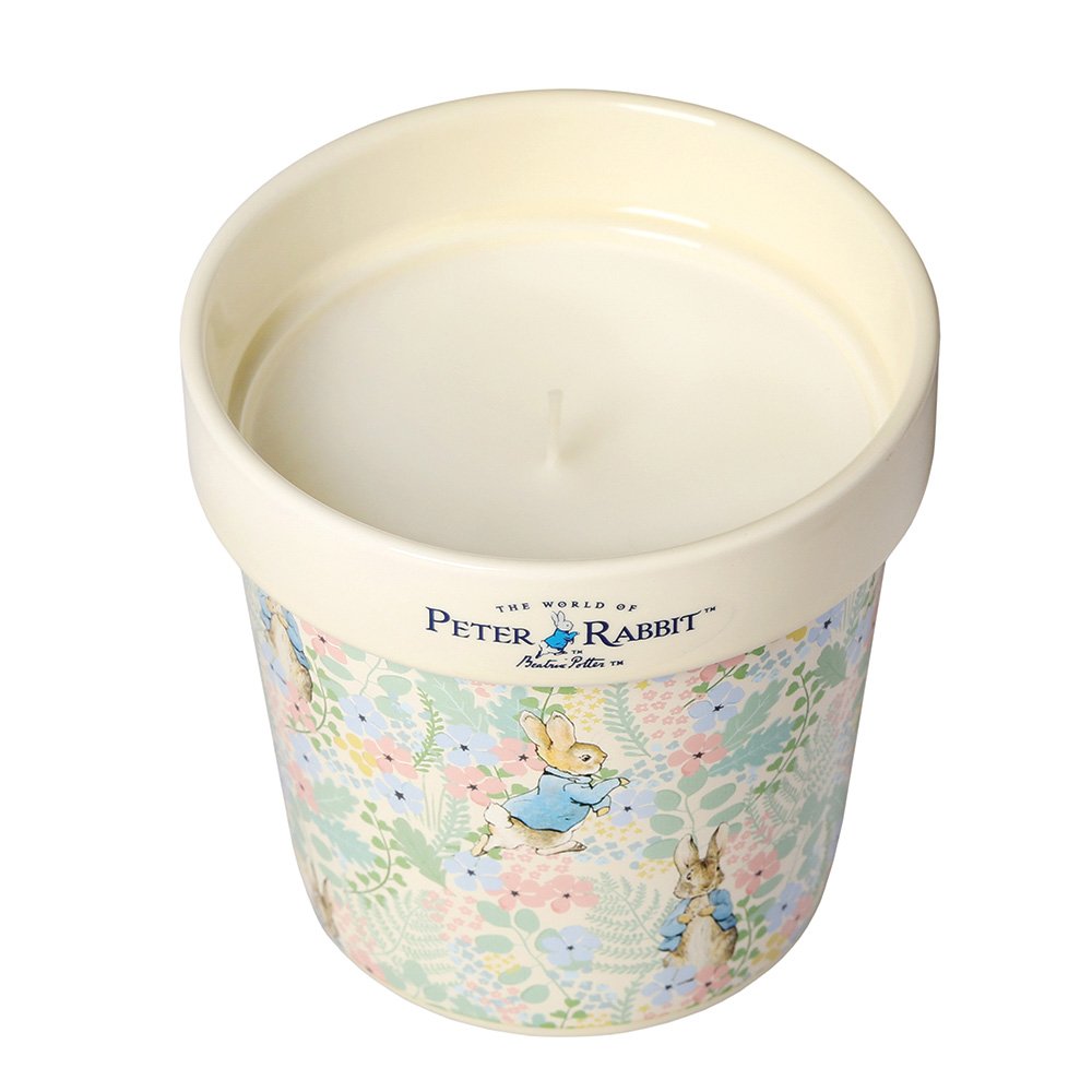 Peter Rabbit Magnolia and Bergamot candle in a floral ceramic jar with Peter Rabbit illustrations.