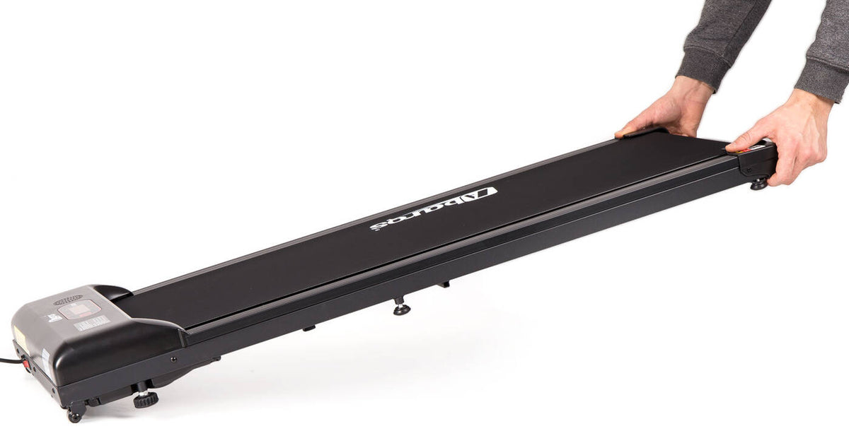 Hands holding the slim, black AbarQs fitness BZ-38.00 electric treadmill walking pad at an angle