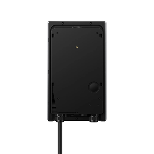 The back view of a black outdoor wall-mounted speaker with a black cable extending downward, shown against a solid white background.