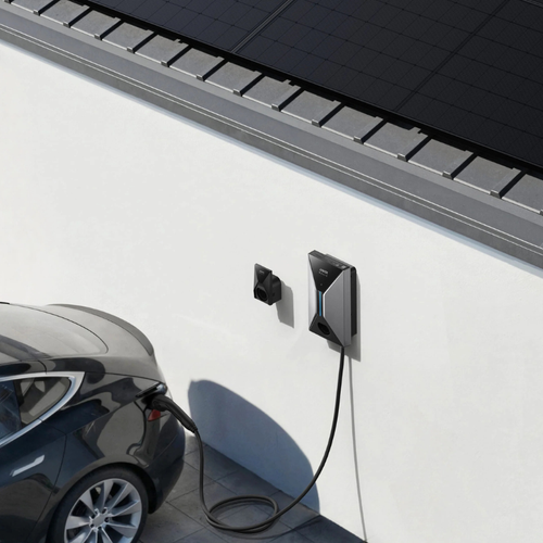 Electric car charging at a charging station on a white wall with solar panels above.