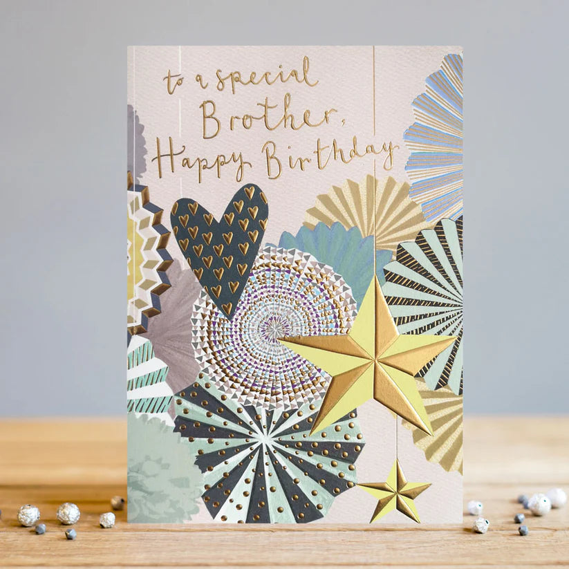 Brother Birthday Card with gold foil text and decorative stars and hearts on textured cardstock.