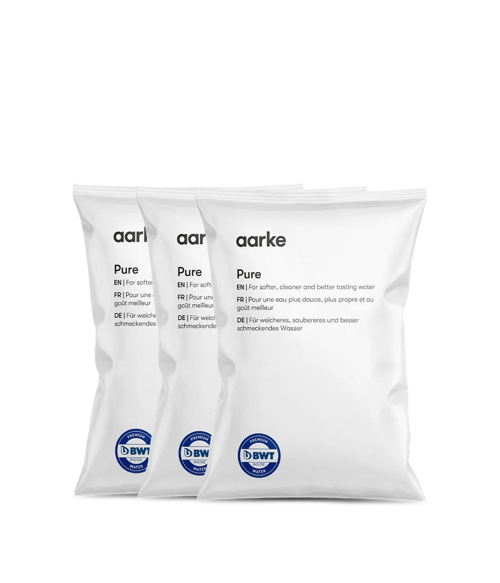 Three white Aarke Filter Granules Refill bags labeled Pure with blue BWT logos stacked side by side.