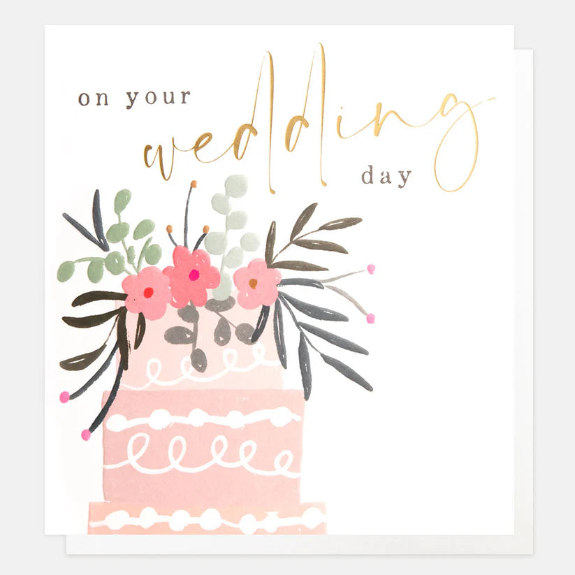 Wedding card with pink cake illustration, floral decoration, and gold foil "on your wedding day" text.