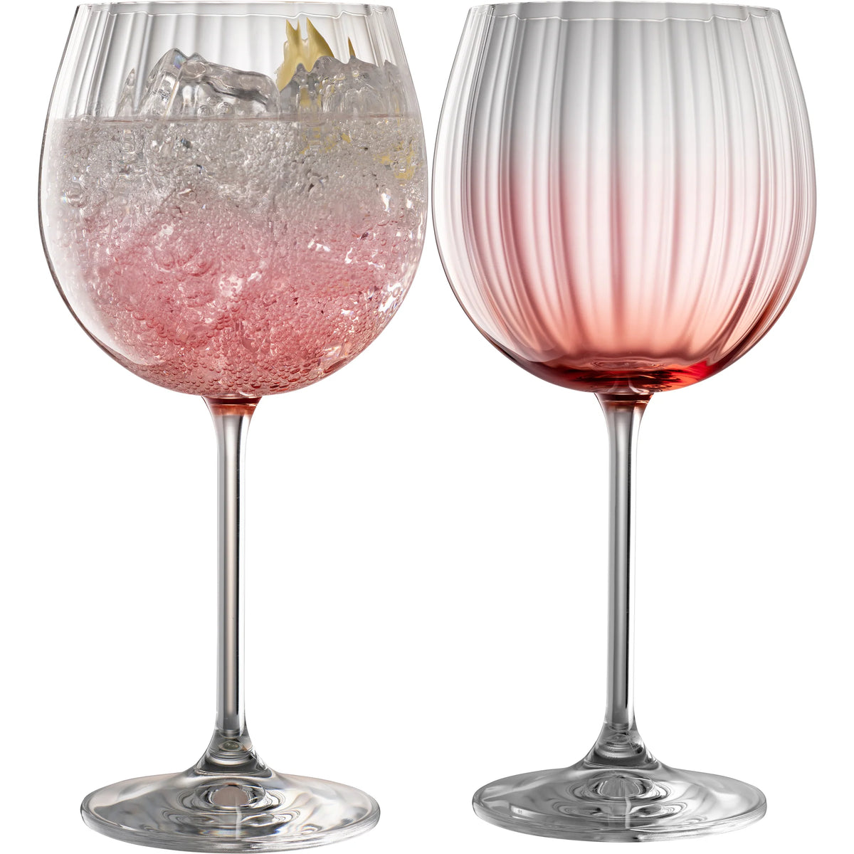 Pair of blush-colored Erne Gin and Tonic balloon glasses with elegant lines, Galway Irish Crystal – Keans Claremorris.