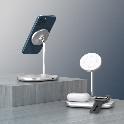 Energizer 3 in 1 Wireless Charger with stand charging a phone, earbuds, and smartwatch on a gray surface.