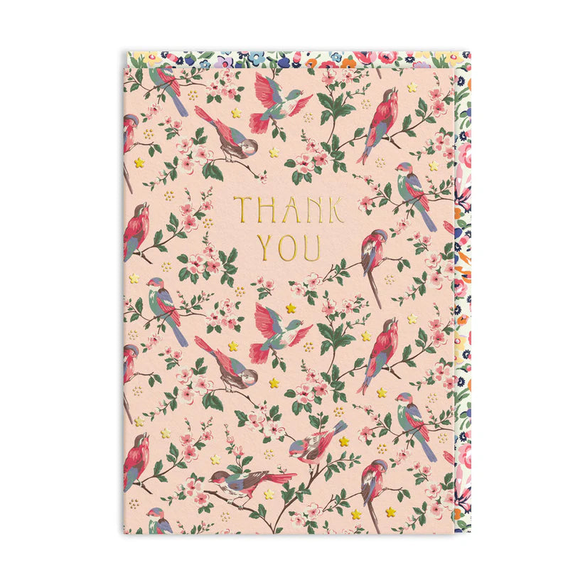 A6 thank you card with colorful birds and floral branches on a pale pink background, gold foil text.