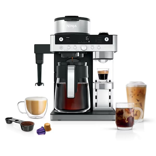Ninja Prestige DualBrew System coffee machine with carafe, milk frother, coffee pods, and various coffee drinks.