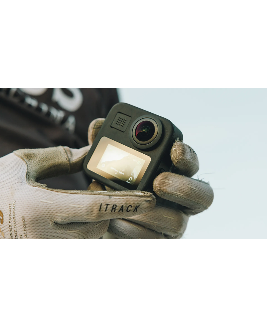 Hands wearing gloves holding a GoPro Hero Max 360 Action Camera with the screen on.