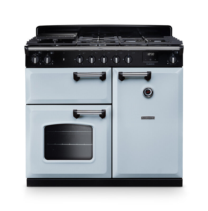 Rangemaster Classic 100cm chrome dual fuel rangecooker with multiple ovens and control knobs on black panel