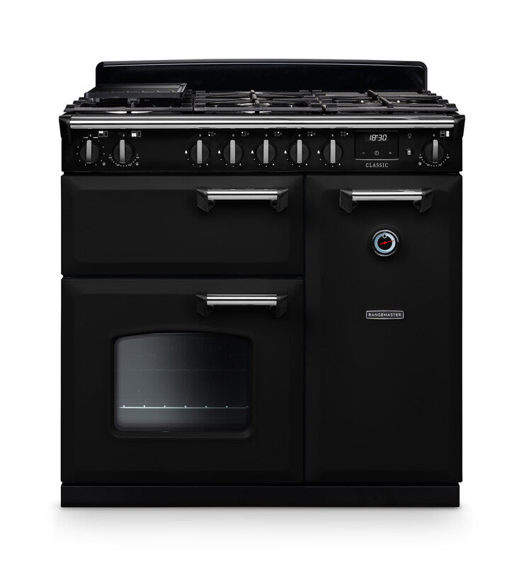 Rangemaster Classic 90cm black dual fuel rangecooker with six burner hob, two ovens, and chrome handles.