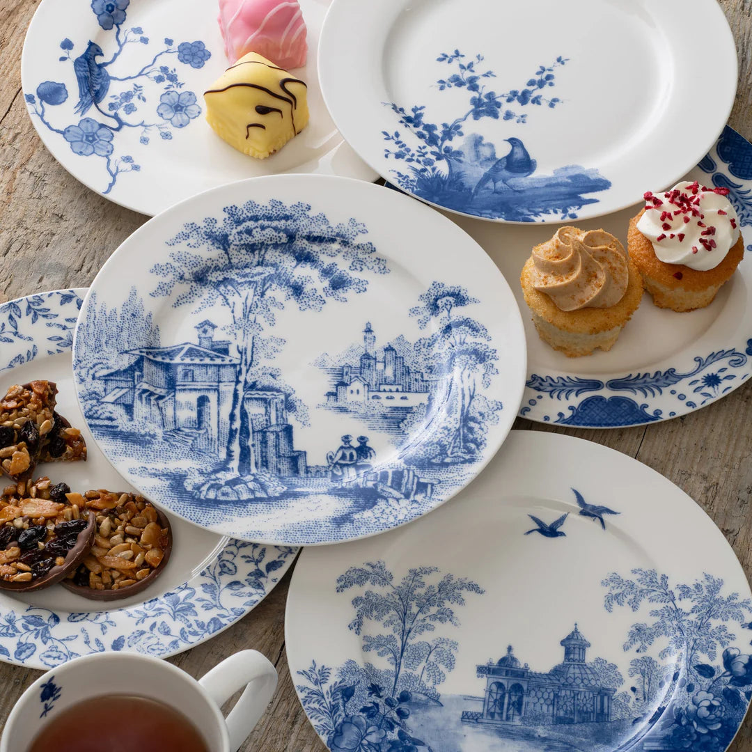 Set of 6 Archive Blue Aynsley teaplates with blue scenic and floral patterns, some with desserts on top.