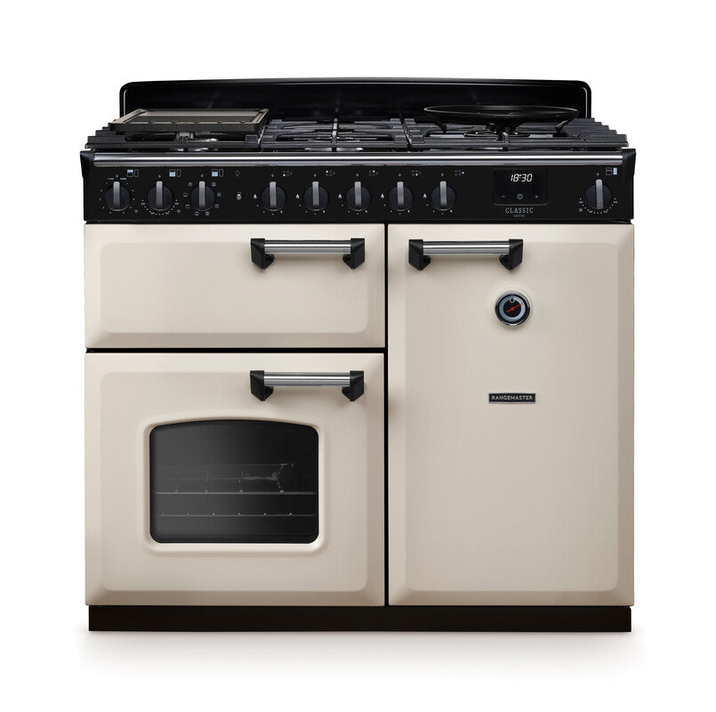 Rangemaster Classic Deluxe 100cm cream dual fuel rangecooker with multiple ovens and burners, front view.