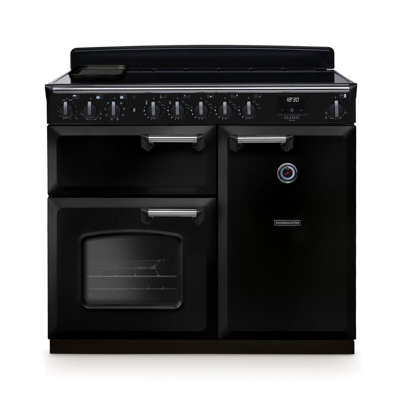 Rangemaster Classic Deluxe 100cm black induction rangecooker with multiple ovens and control dials on top panel