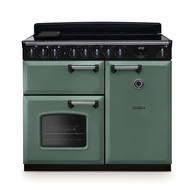 Rangemaster Classic Deluxe 100cm chrome induction rangecooker in green with multiple oven doors and control knobs