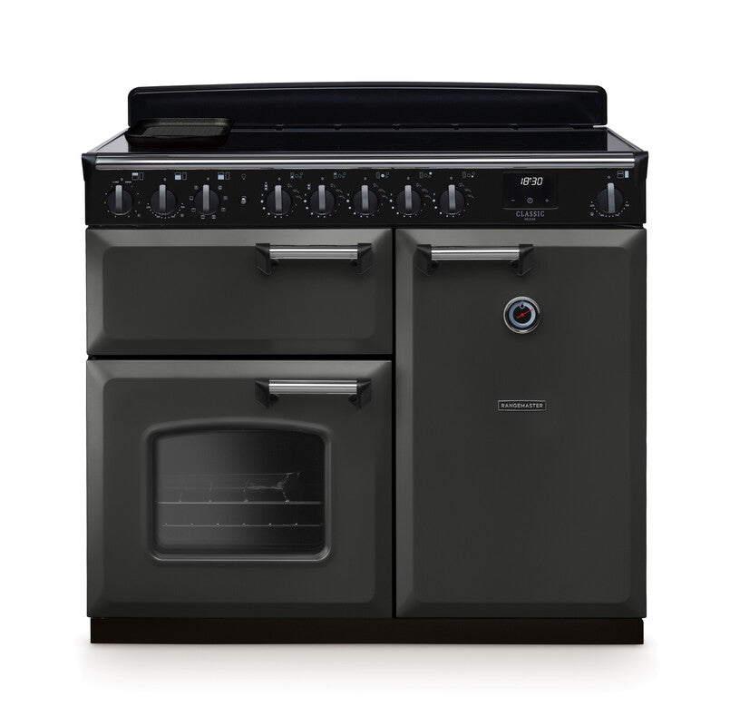 Rangemaster Classic Deluxe 100cm induction rangecooker in matte black with multiple ovens and control knobs