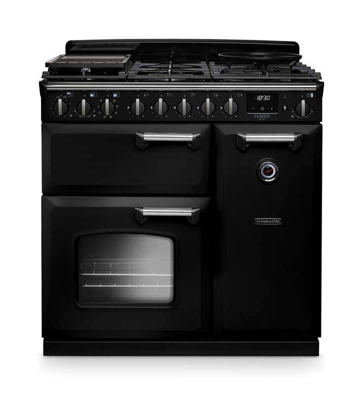 Rangemaster Classic Deluxe 90cm black dual fuel rangecooker with six burners, two ovens, and chrome handles.
